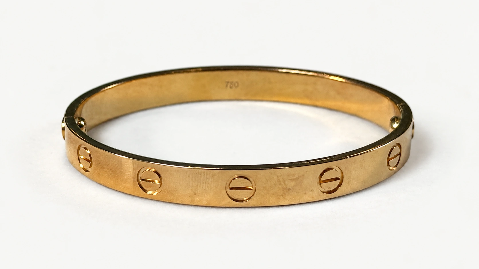 Foto 3: CARTIER - Bracelete Love em ouro rosé 18k, tamanho 16. Peso: 28,9 gramas.